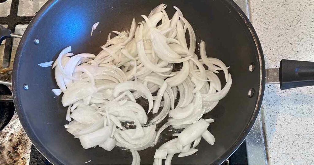 exican Chipotle Fajitas. Onion in wok